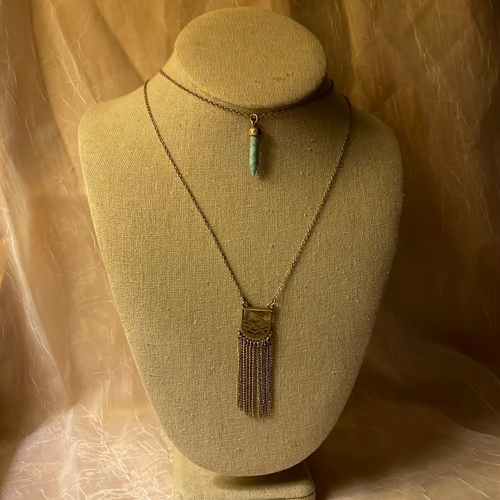 Light gold colored necklace 2 stranded w/faux turquoise &metal design w/fringes